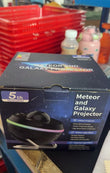 13-in-1 Galaxy Projector Lamp displaying colorful rotating planets and star patterns on a dark background.