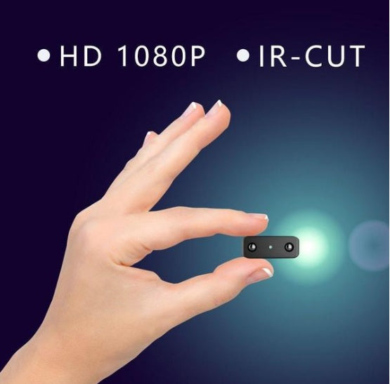 Small 1080P Full HD camcorder with infrared night vision, motion detection, compact design, suitable for discreet video recording.